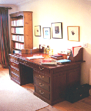 Custom made pedestal desk with 7 drawers including 2 file drawers in solid rosewood.